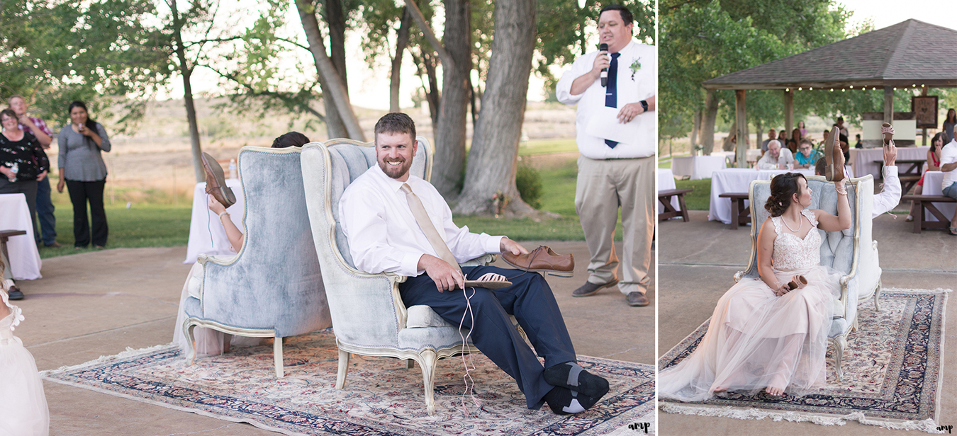 Bride and groom play the shoe game on antique area rug