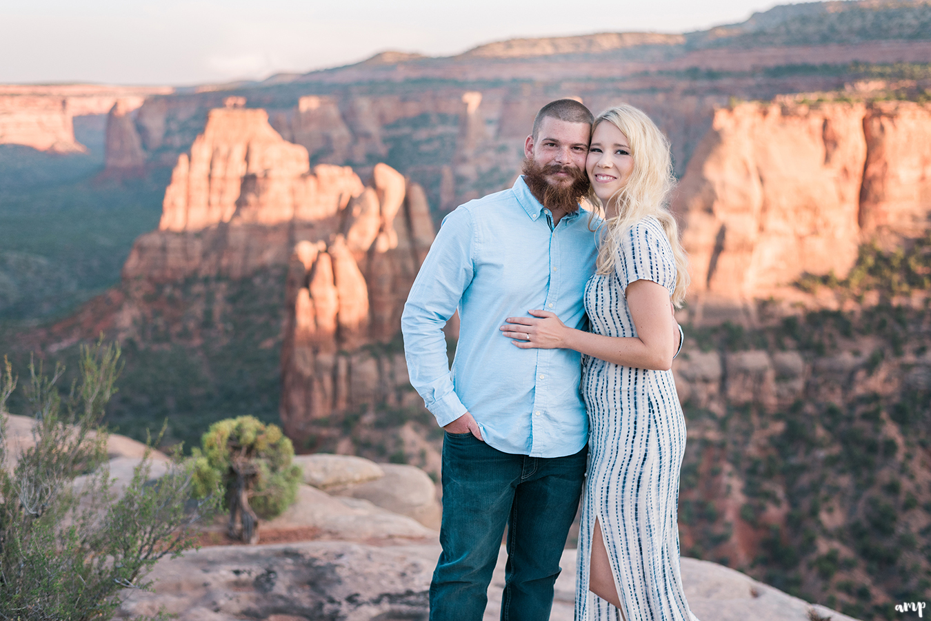 Engaged couple in the Colorado National Monument arm in arm