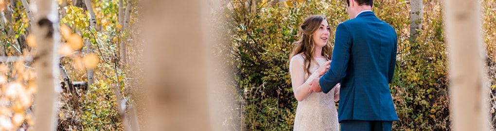 Couple exchanging private vows at Woods Walk in Crested Butte